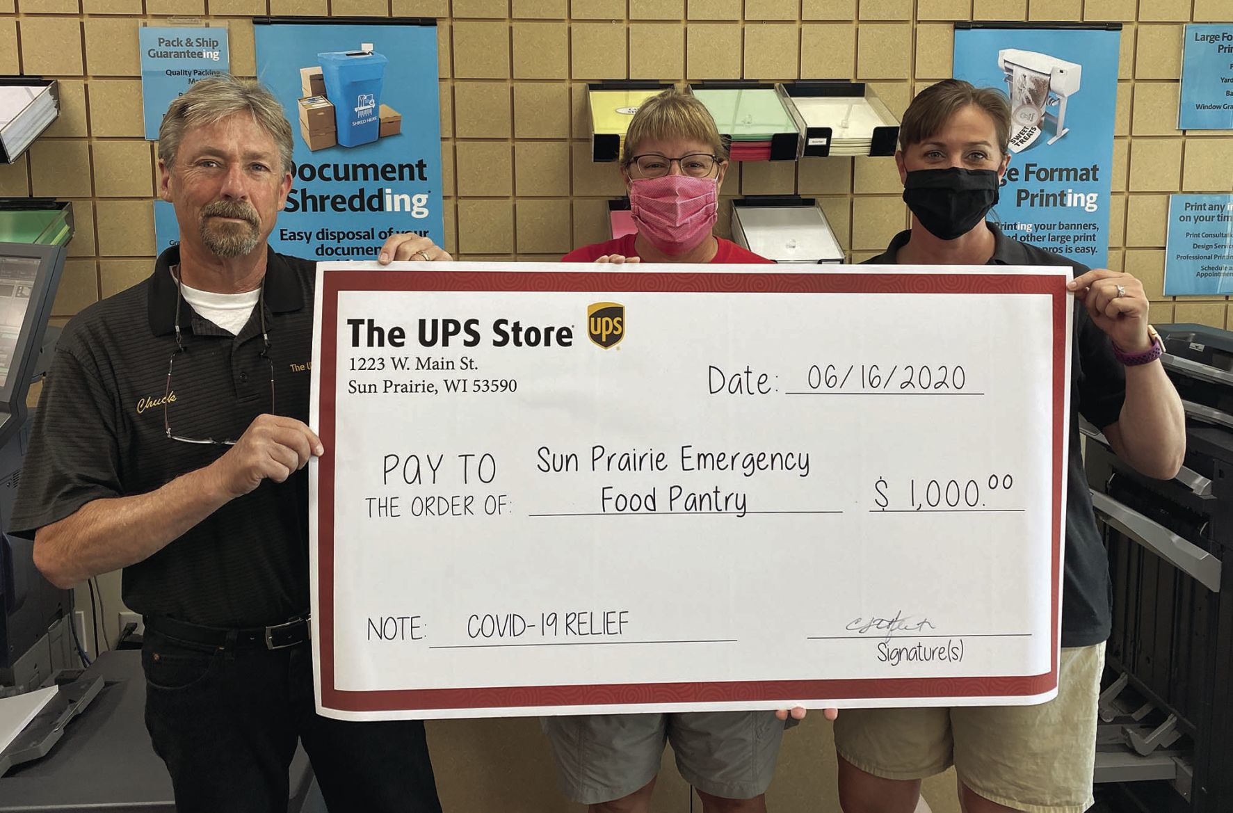 UPS Store donates to Food Pantry